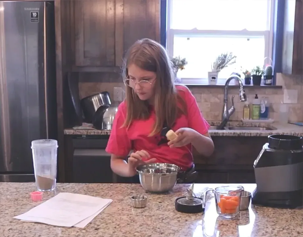 Mashing the banana for the biscuit mixture