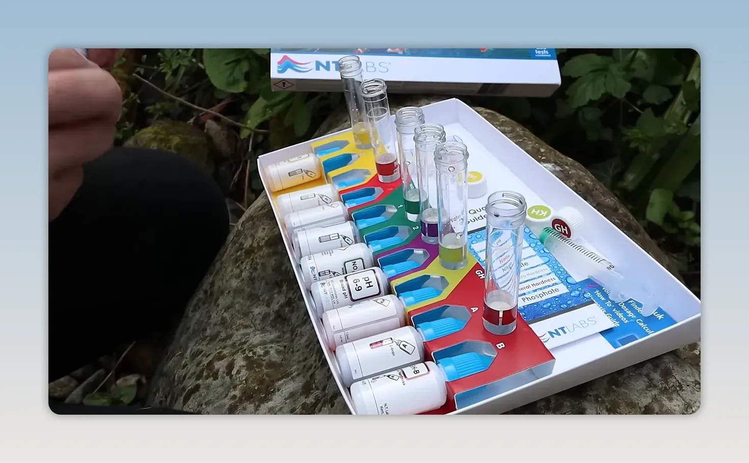 Aquarium water test kit with colour comparison chart, bottles and test tubes