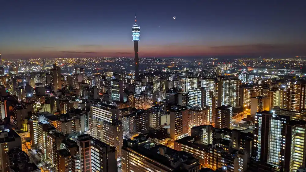 Johannesburg city skyline aerial view of illuminated buildings in city at night