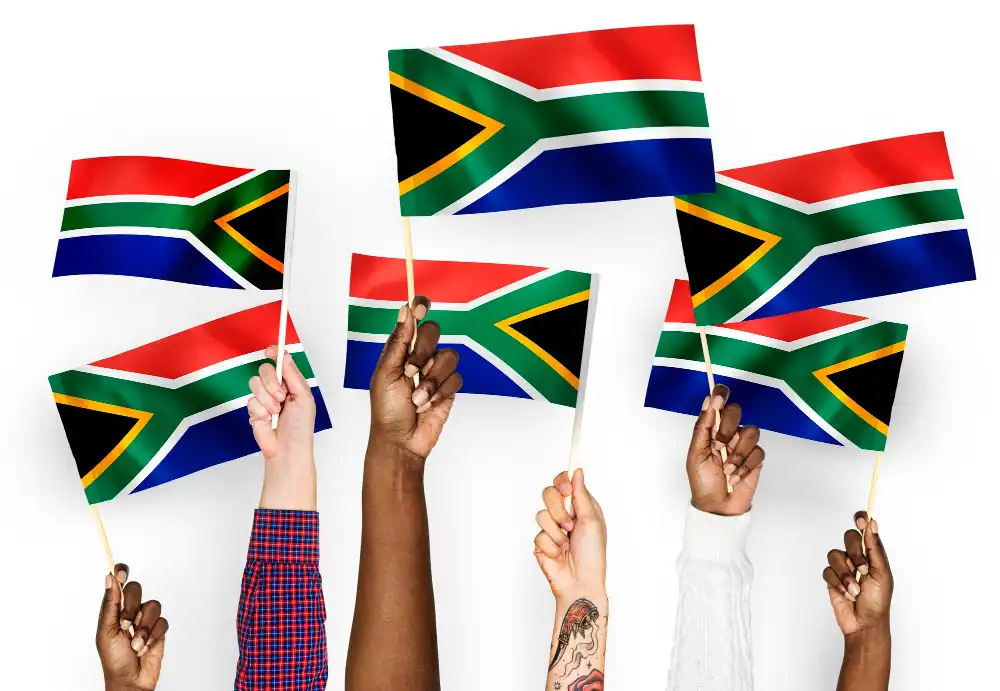 Hands waving flags of South Africa