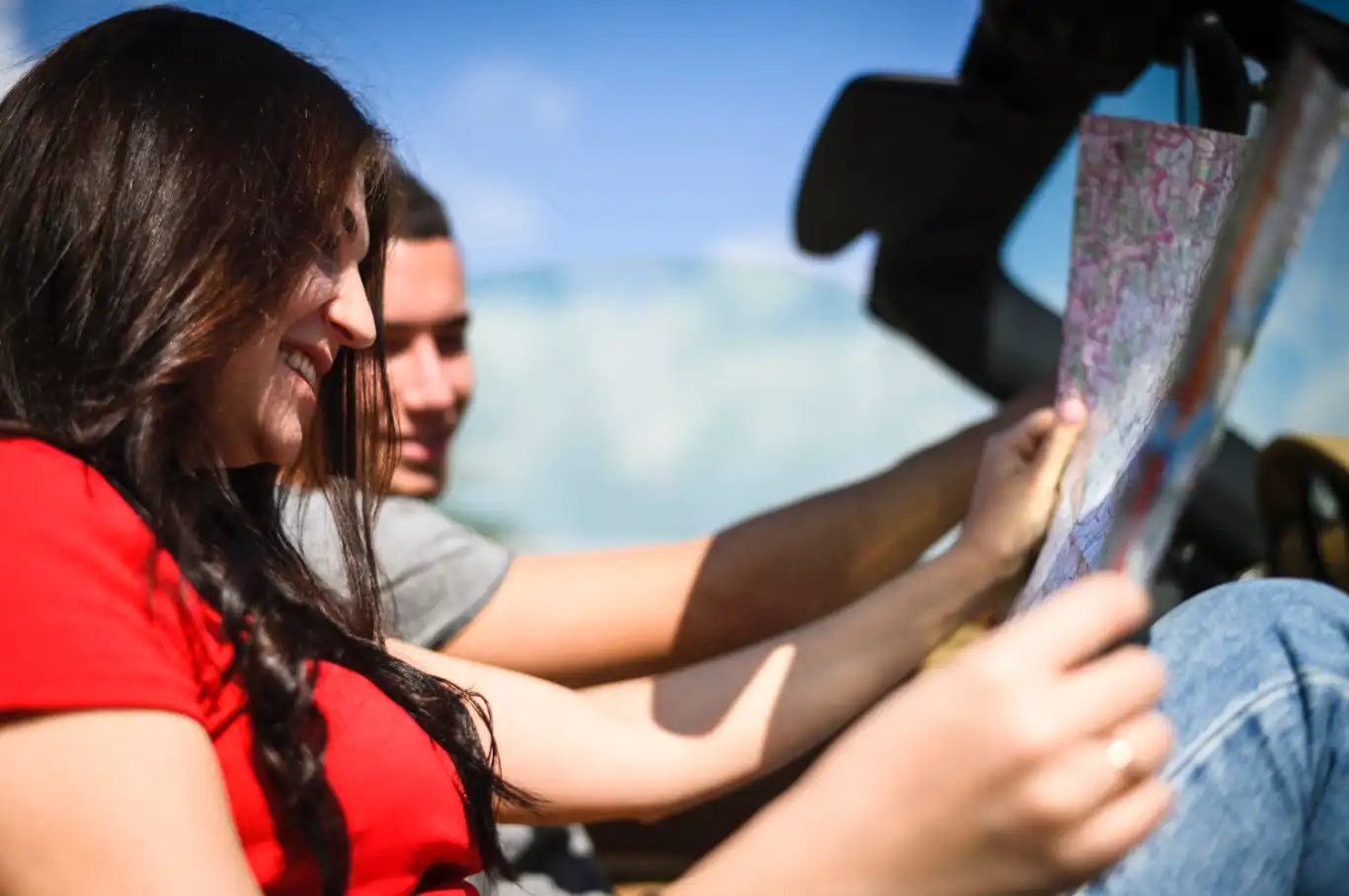 Happy couple looking at map