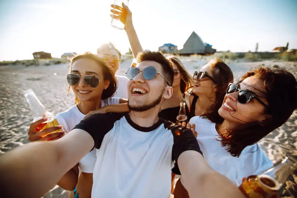 Group of young friends taking selfie and having fun on the beach Summer holidays vacation relax