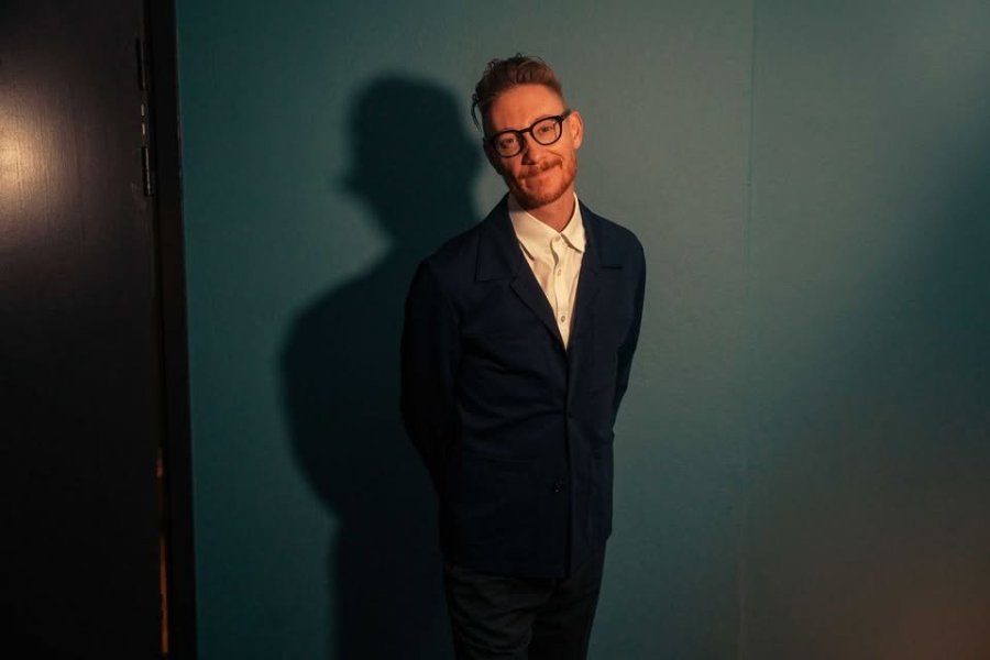 May be an image of one or more people, glasses and suit