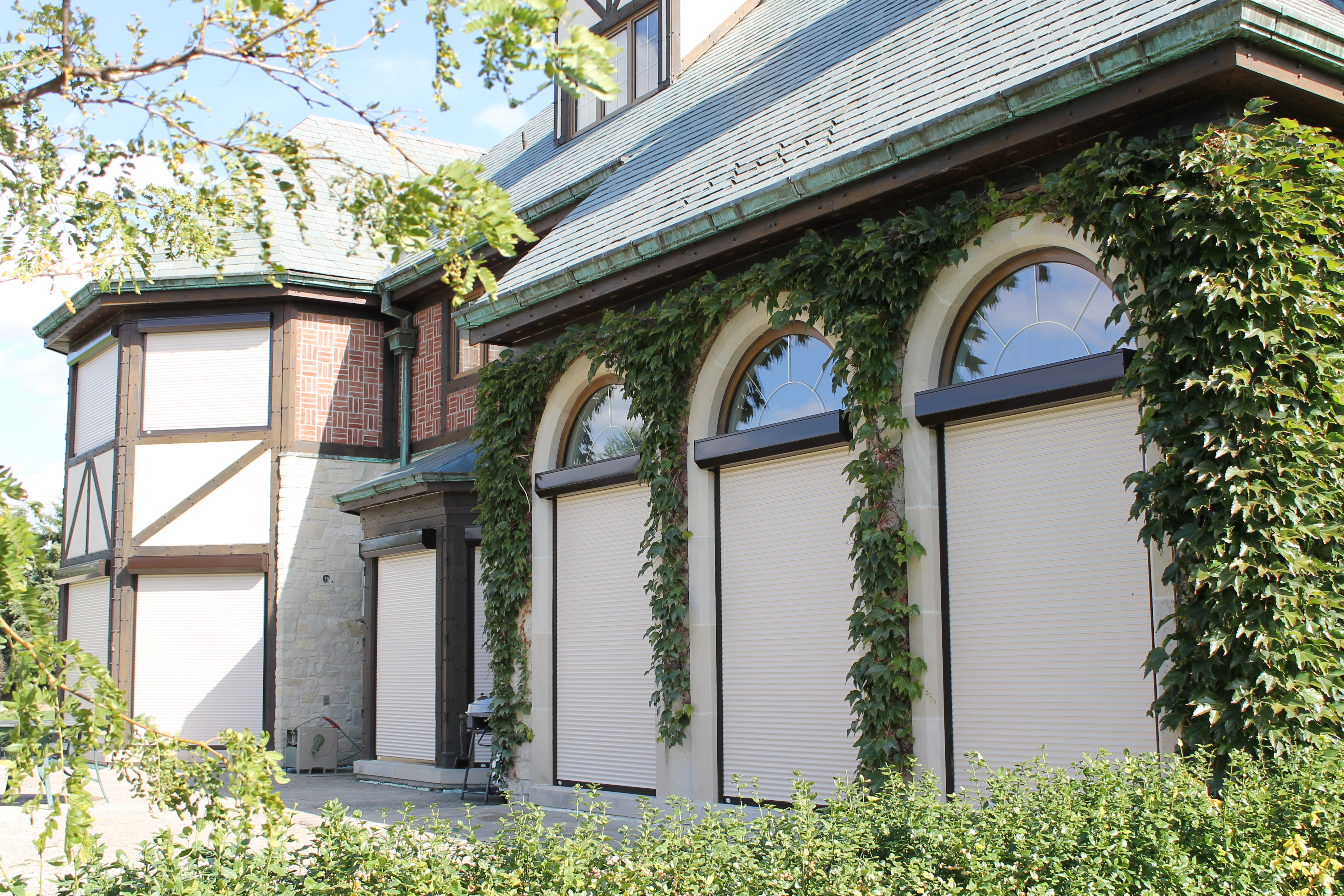  Security Shutters in a home with arched windows