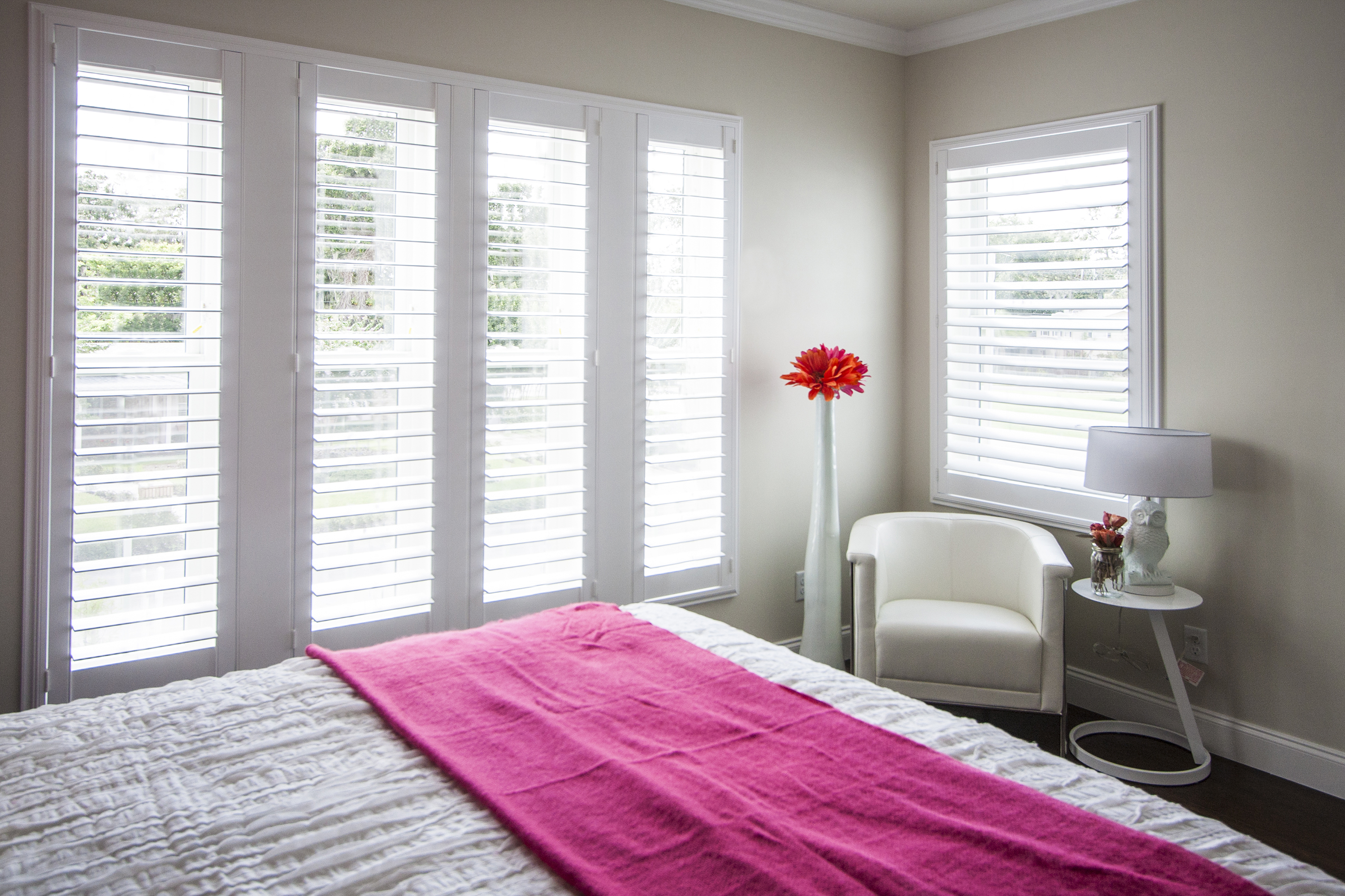 White california shutters by VistaShades in bedroom for full light control