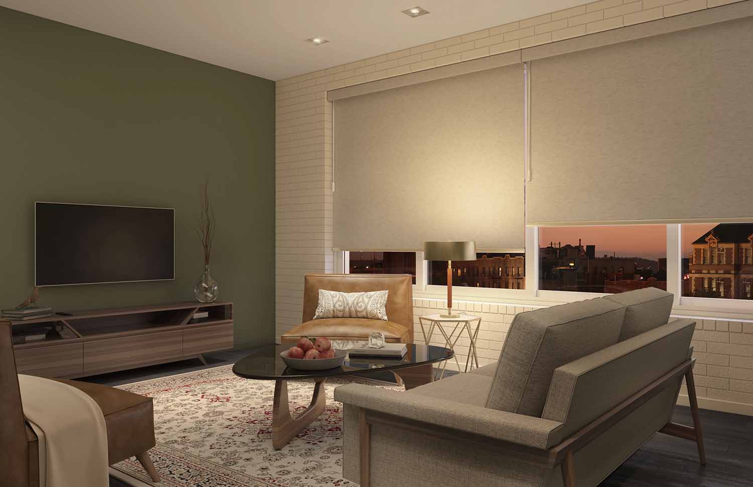 Light coloured roller shades in living room looking at tv on green wall