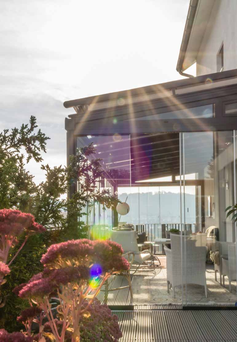 Enclosed Patio with Mounted Sun Shade on Glass Roof