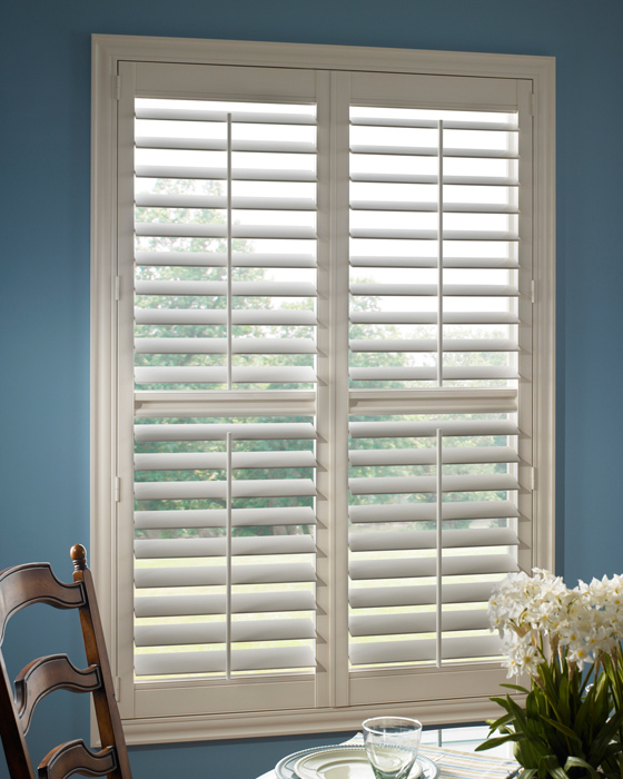 Shutters in dining room with blue walls