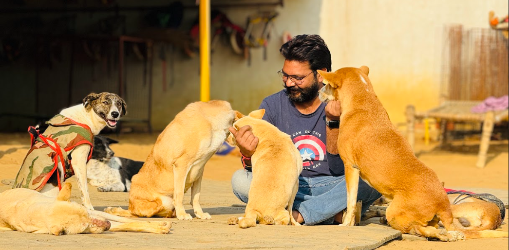 Singh with a paralyzed dog in a custom wheelchair