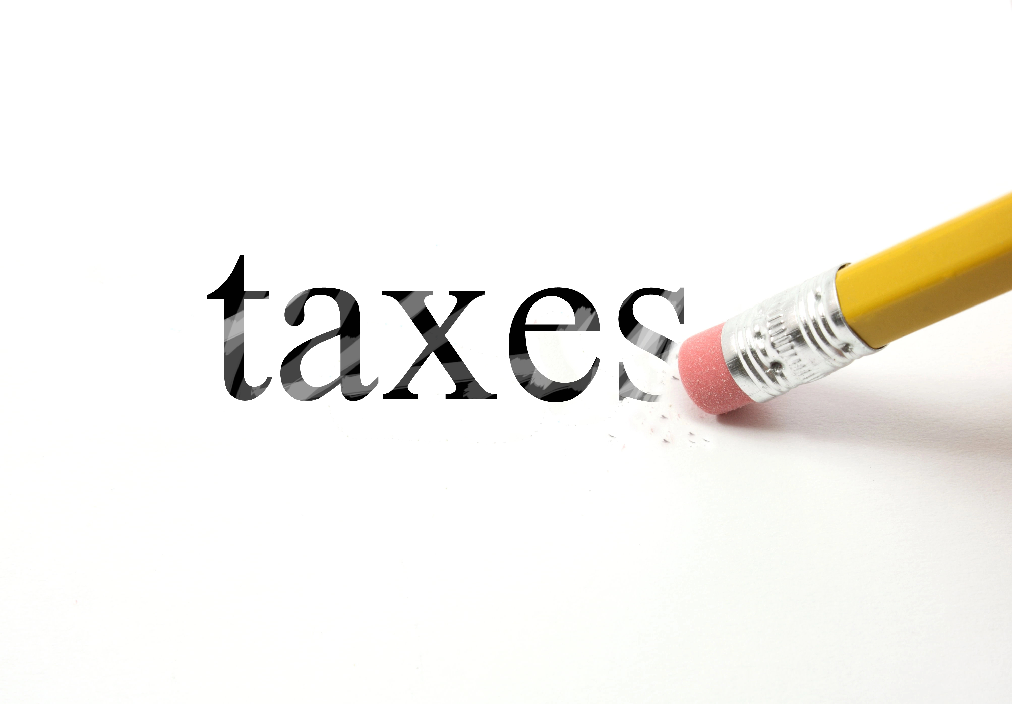taxes being erased with yellow pencil