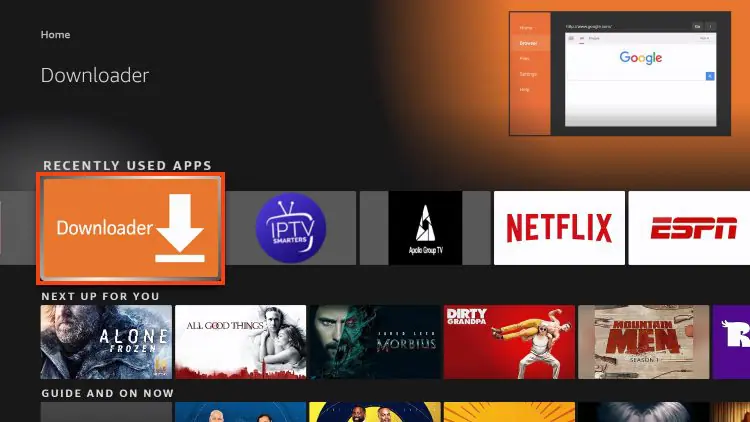 Firestick home screen with Downloader app icon.