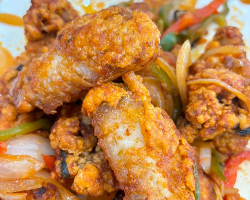 L35 Ailes de poulet sautées au basilic