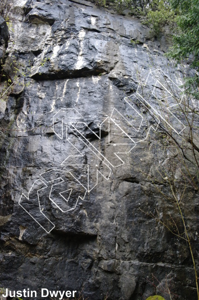 photo of Squeeze Ur Mout To Da Right An Say... Ouin, 5.11d ★★ at Dank Wall from Ontario: Devil's Glen