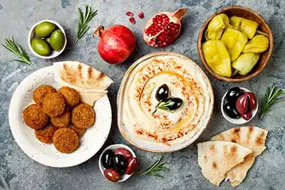 Felfela Kraków | A plate of food with bread and a bowl of salad Kraków, Poland2025