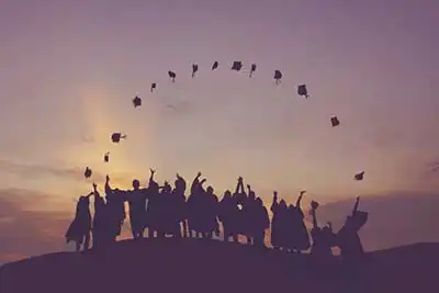 Math Tutoring | Graduates at dawn joyfully throwing their caps into the air Florida, USA2023