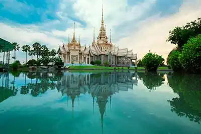Phuket Taxi Services | Beige temple reflecting on a body of water. Phuket, Thailand2023