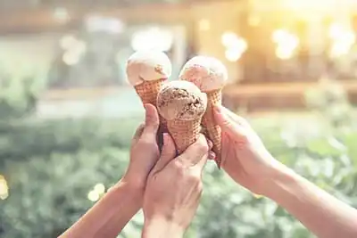 Shen Shen Ice Cream | Three hands holding ice cream cones in a joyful, summer gesture Hurghada, Egypt2023