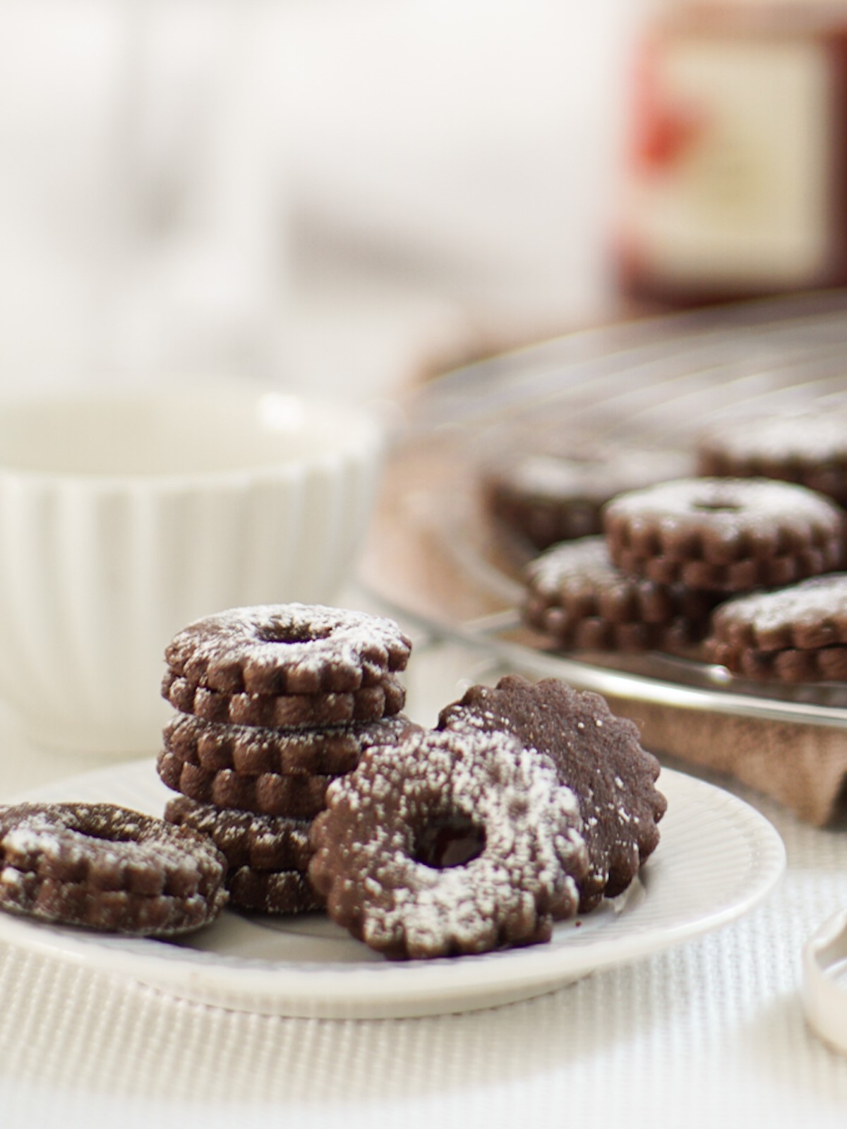 Crispy chocolate cookies with strawberry marmalade spread. 