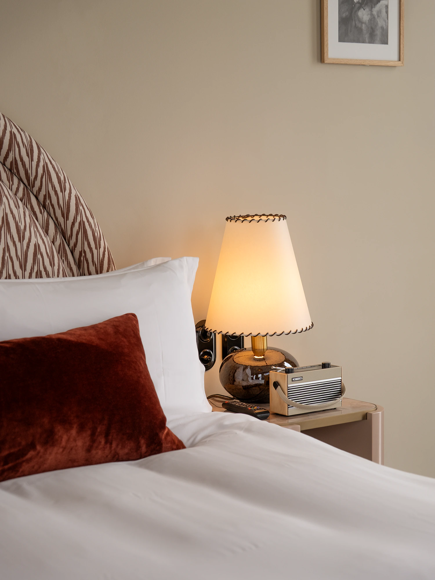 bed and bedside table in the room at the Hoxton Brussels