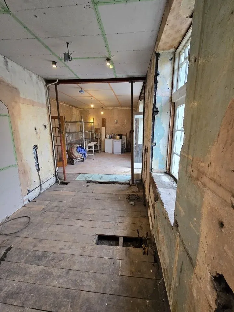 Kitchen and dining room renovation prep in Redland, Bristol BS6, featuring ceiling overboarding, structural supports, and site setup for professional plastering.