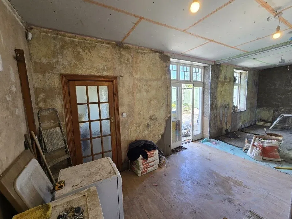 Kitchen and dining room renovation prep in Redland, Bristol BS6, featuring ceiling overboarding, structural supports, and site setup for professional plastering.