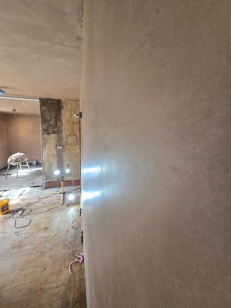 Close-up of a smooth, professional plaster skimming finish on a wall during a kitchen and dining room renovation in Redland, Bristol BS6.