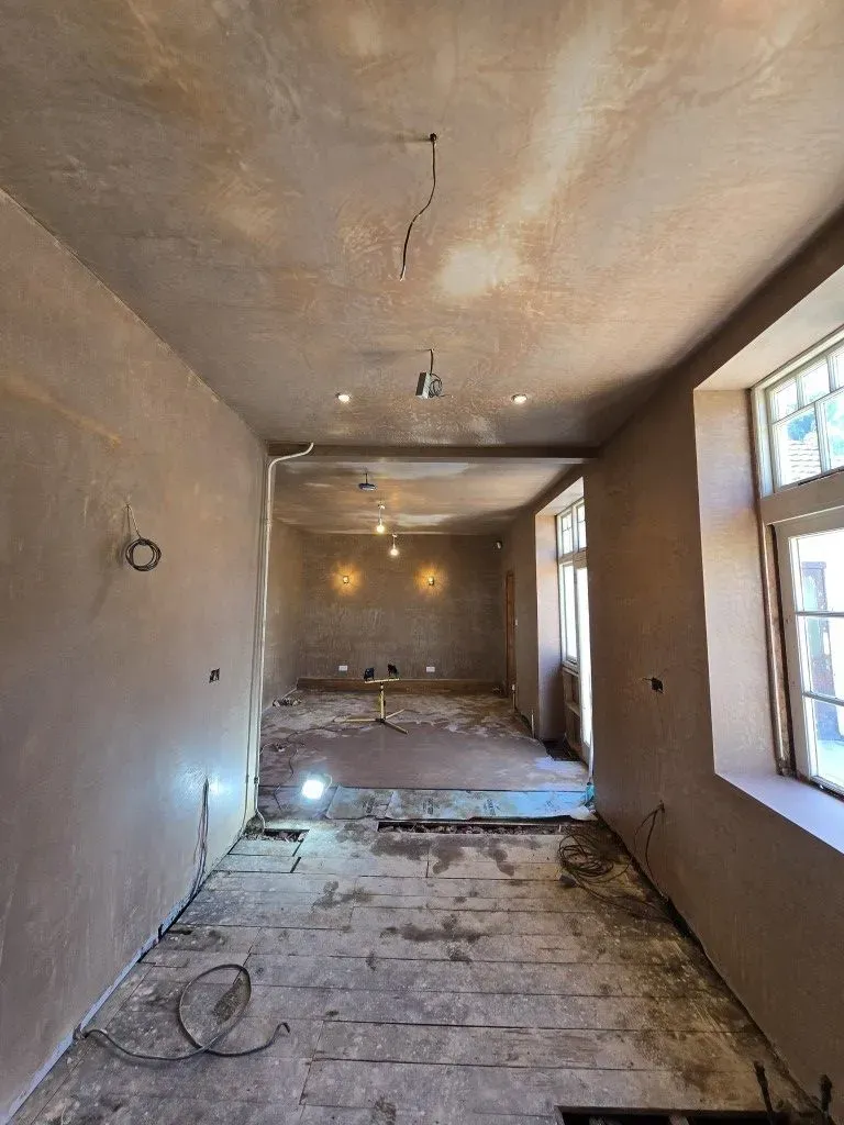 Freshly completed internal plastering and ceiling skimming for a period property renovation in Redland, Bristol, showing a high-quality smooth finish.