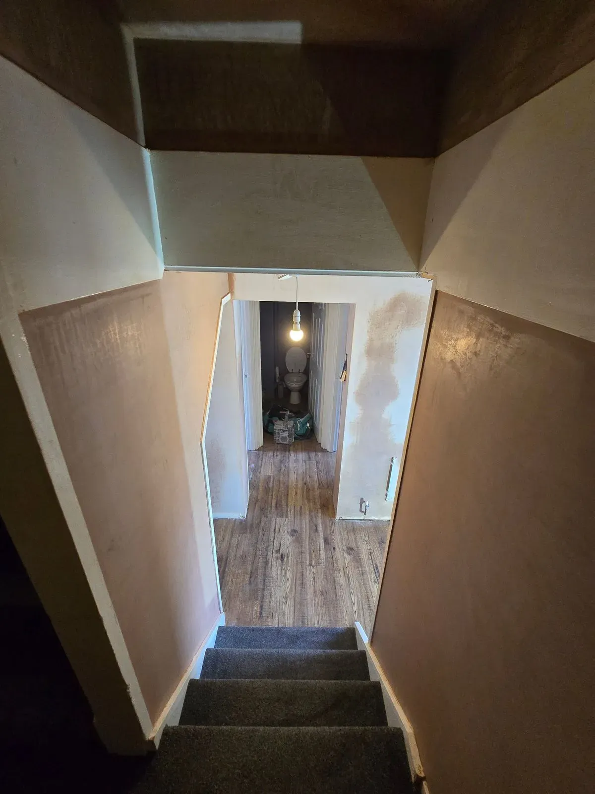 Plastering finish around tricky under-stairs angles and hallway transitions