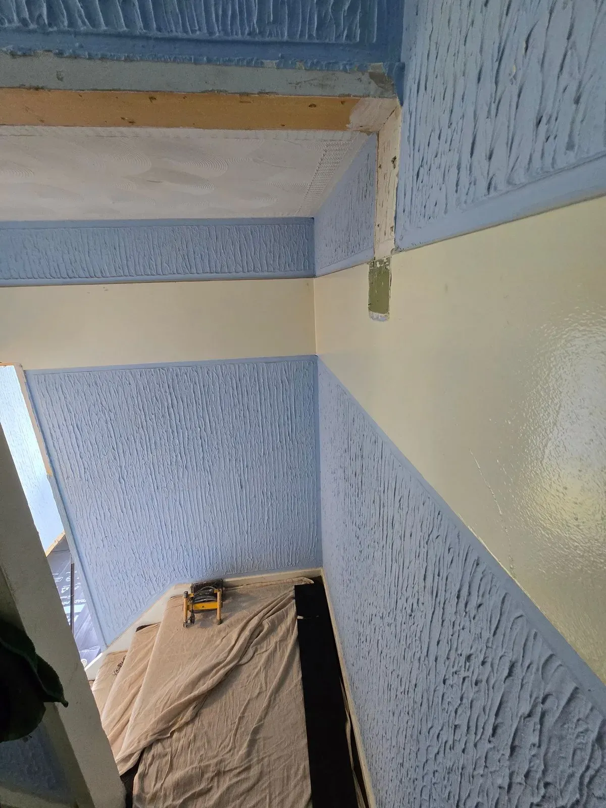 Heavy Artex wall texture prep; all surfaces tested for asbestos before plastering begins in South Gloucestershire