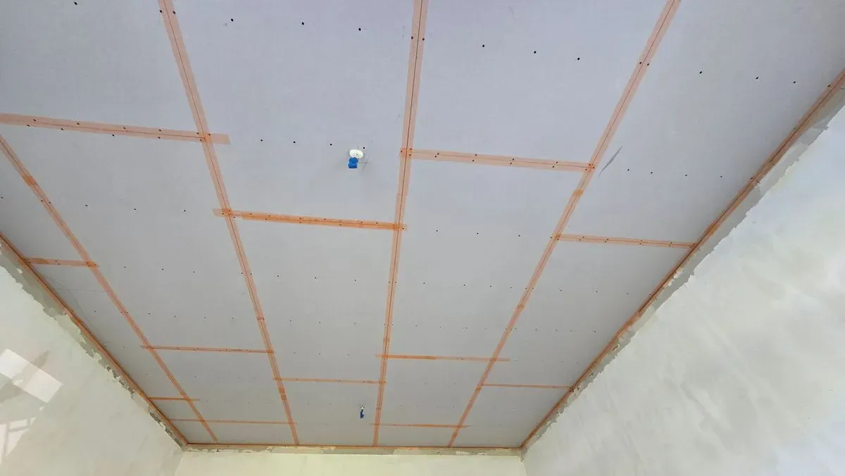 Ceiling tacking and scrim taping in Weston-super-Mare (BS24) to prevent future cracks before skimming.