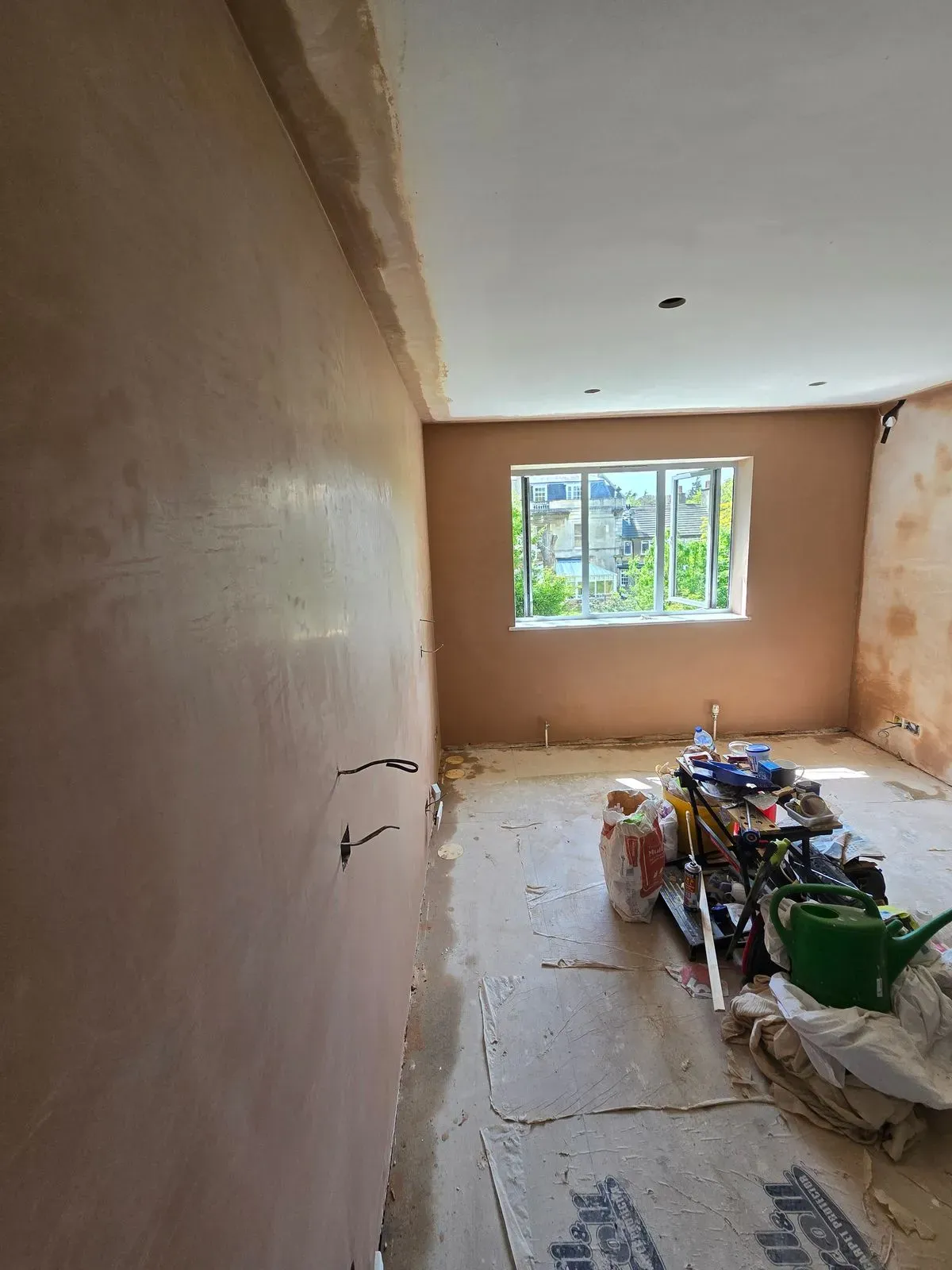 Signature glass-smooth plaster finish on master bedroom walls by JNS Plastering Services in Westbury-on-Trym.