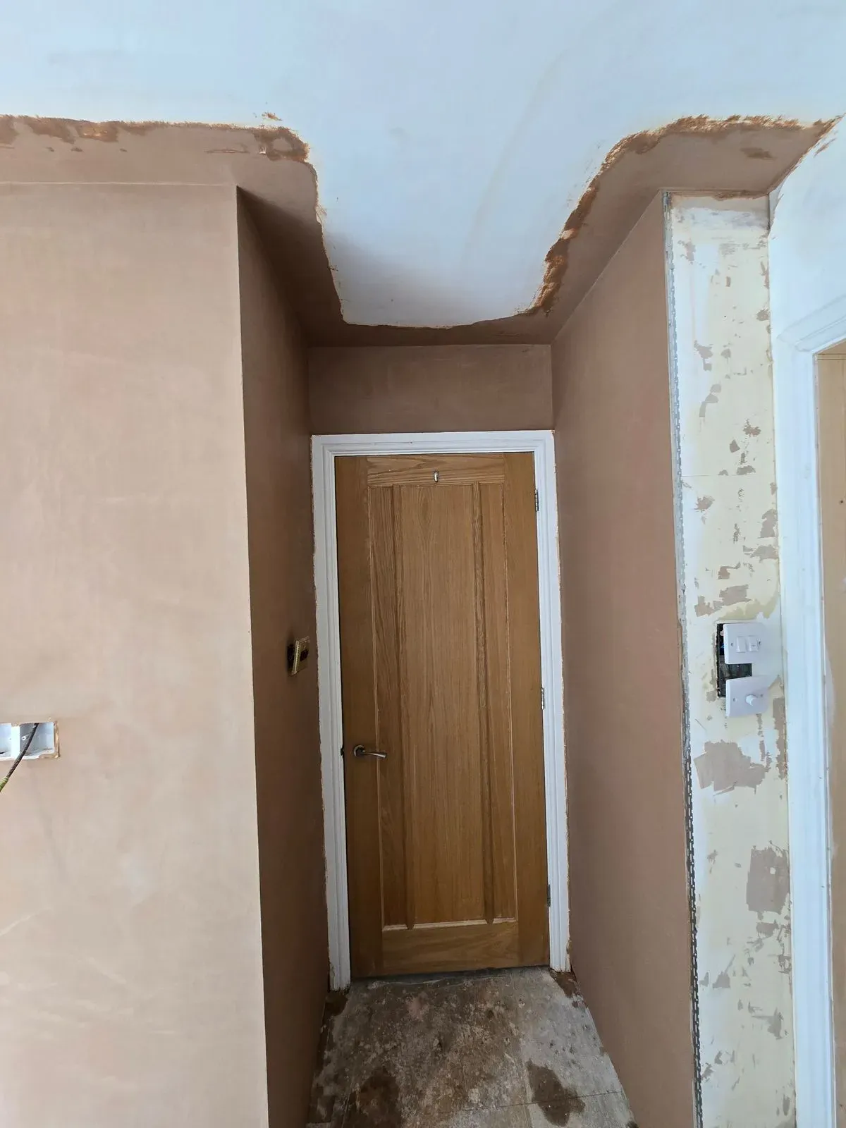alt=Expert plaster patch repair and ceiling blending after old coving removal in a Bristol master bedroom renovation.