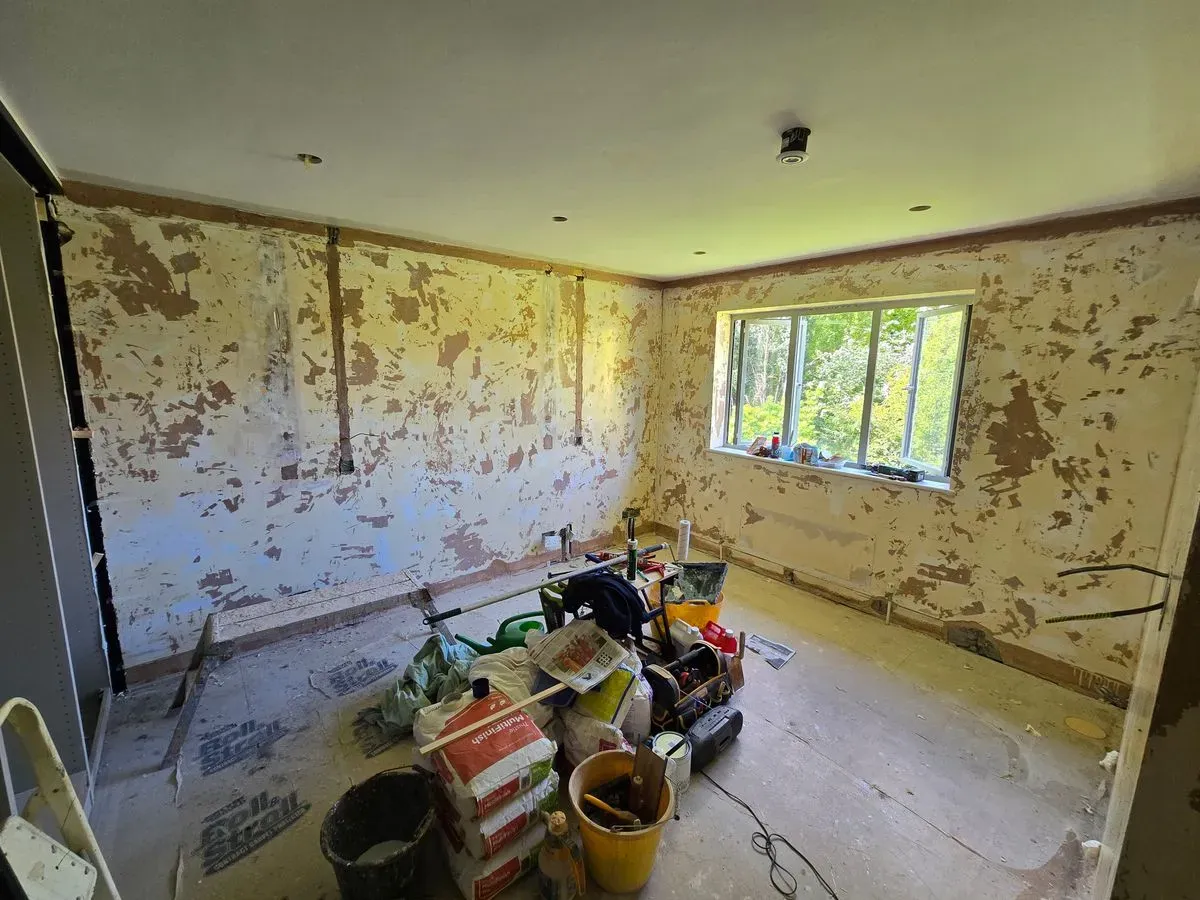 Master bedroom wall preparation in Westbury-on-Trym BS9, stripping old wallpaper and prepping surfaces for professional plastering.