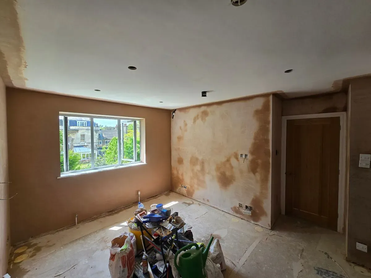 Full view of a master bedroom skimmed by JNS Plastering, highlighting the high-quality finish and clean workspace.