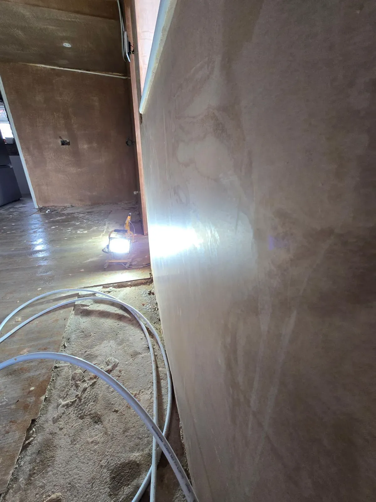 Glass-smooth multi-finish plastering reflecting light in a Rangeworthy kitchen bs37