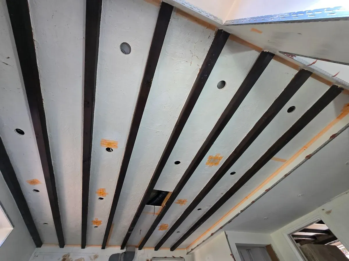Professional ceiling prep and masking around traditional dark wood beams in Rangeworthy