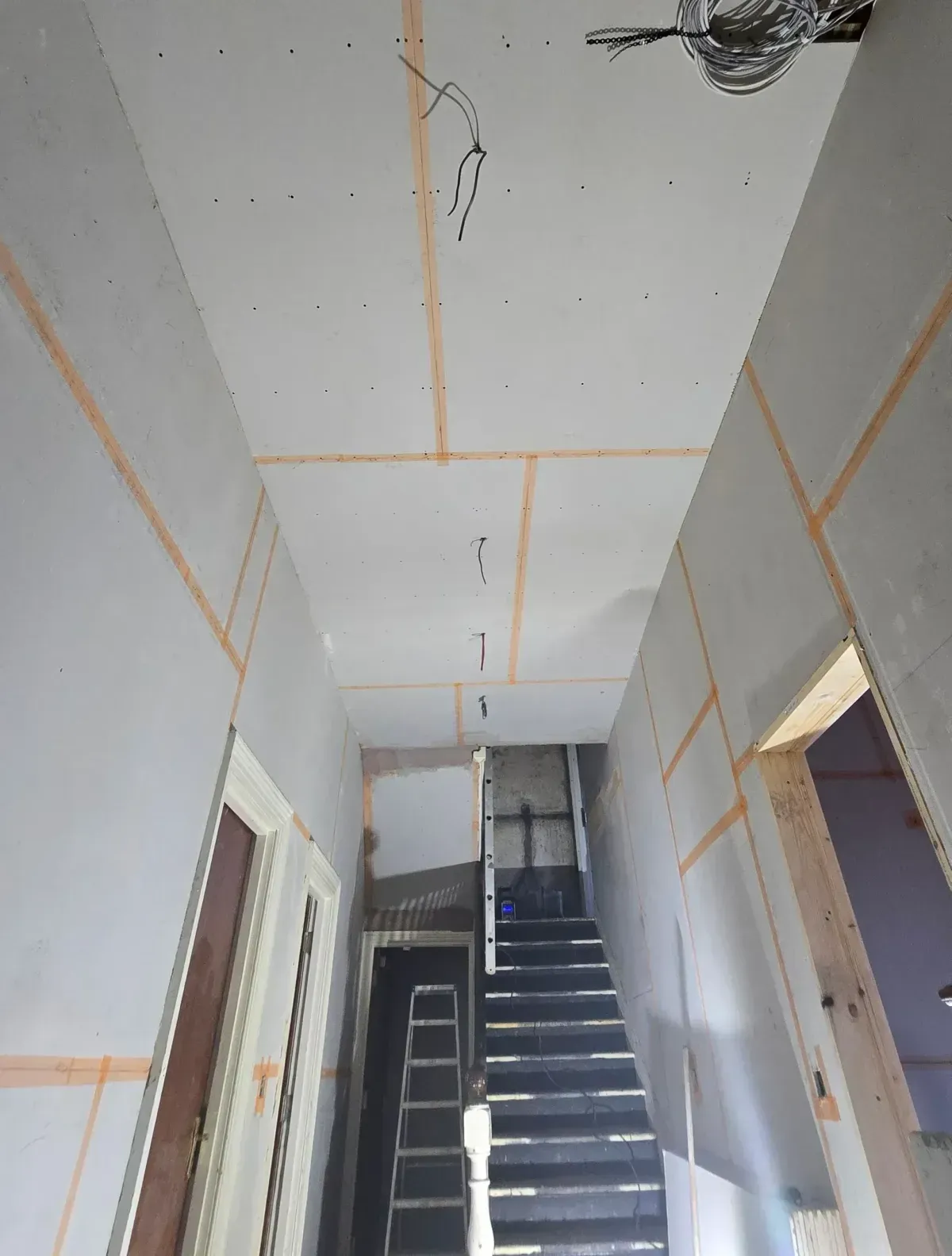 Drywall plasterboard Installation image from our job in ST Andrews skrim taped applied to stop plasterboard cracking once plastered  work carried out by JNS plastering services BS7