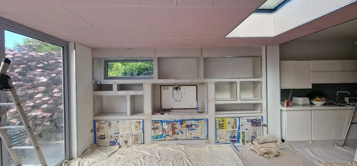 BEFORE PICTURES OF FULL MEDIA WALL PREPPED AND PLASTERED BY JNS PLASTERING SERVICES