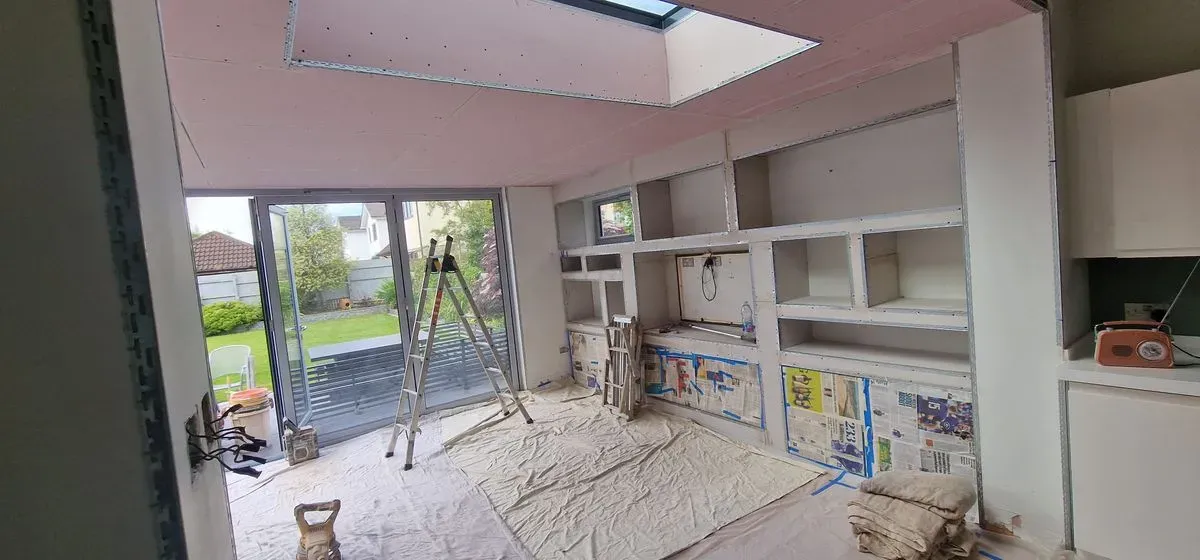 BEFORE PICTURES OF FULL MEDIA WALL PREPPED AND PLASTERED