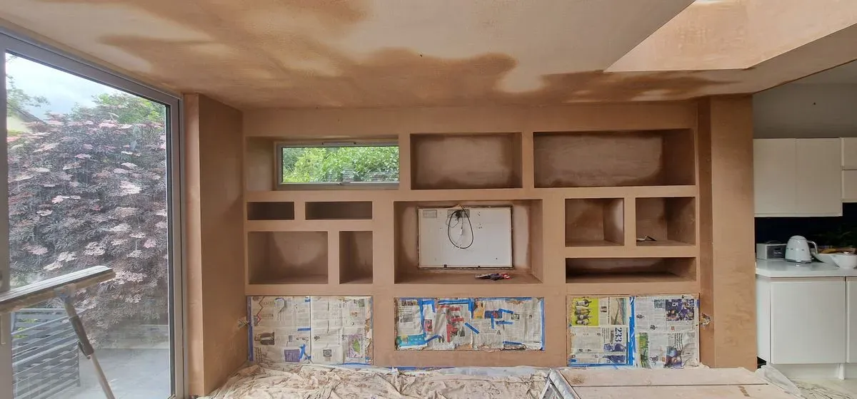 AFTER PICTURES OF FULL MEDIA WALL PREPPED AND PLASTERED BY JNS PLASTERING SERVICES