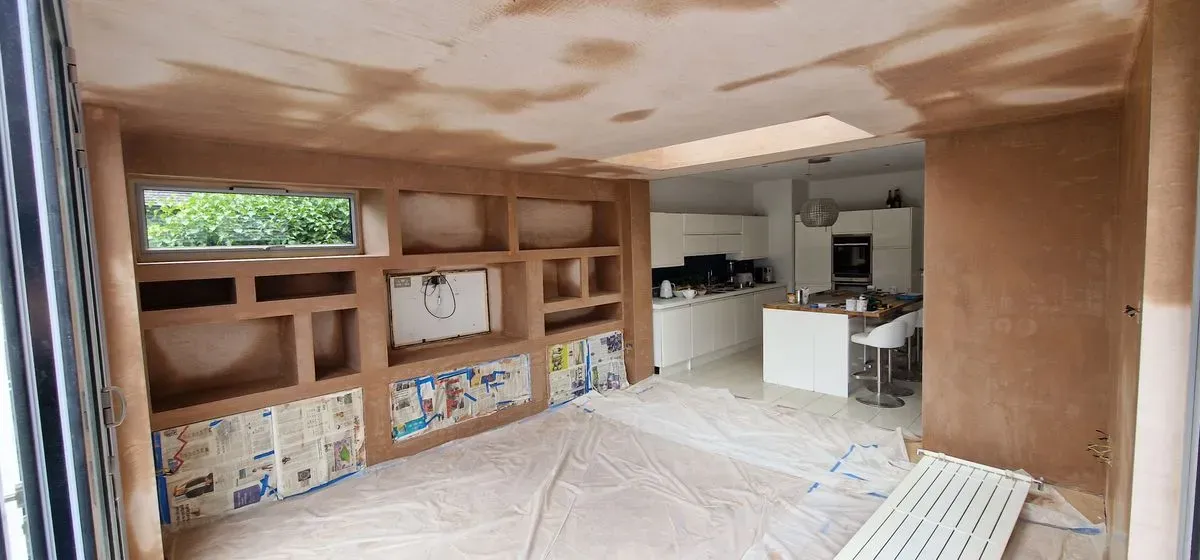 AFTER PICTURES OF FULL MEDIA WALL PREPPED AND PLASTERED BY JNS PLASTERING SERVICES