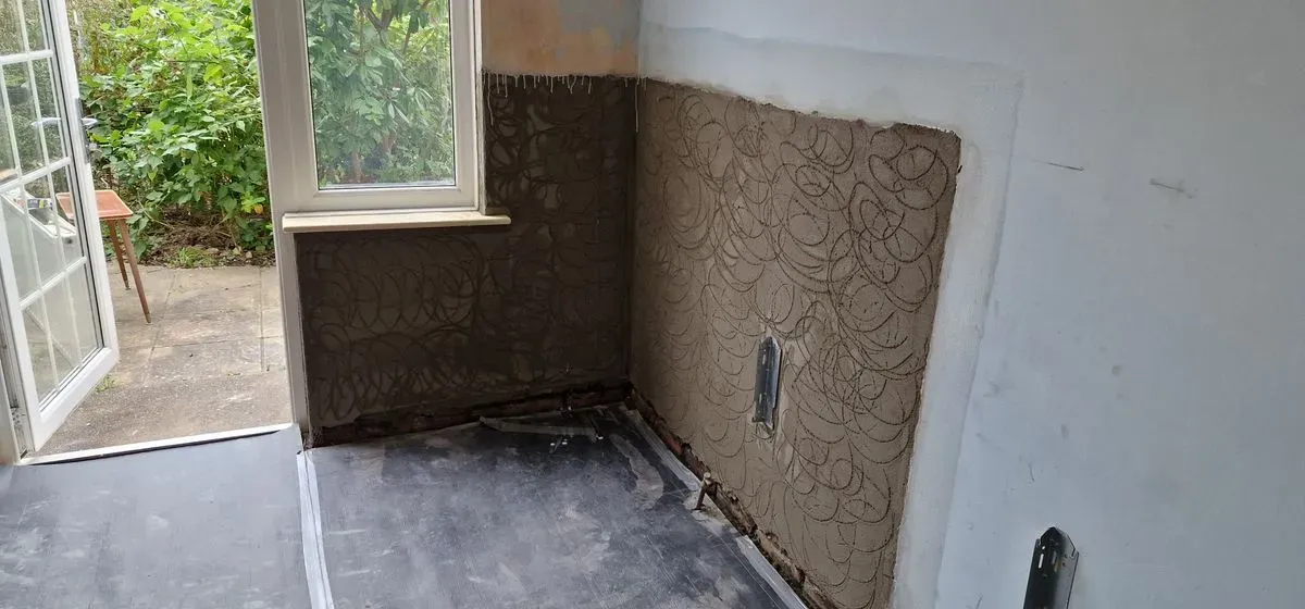 local job in Filton Bristol damp wet render removed and a new DPC cream damp course installed at floor level