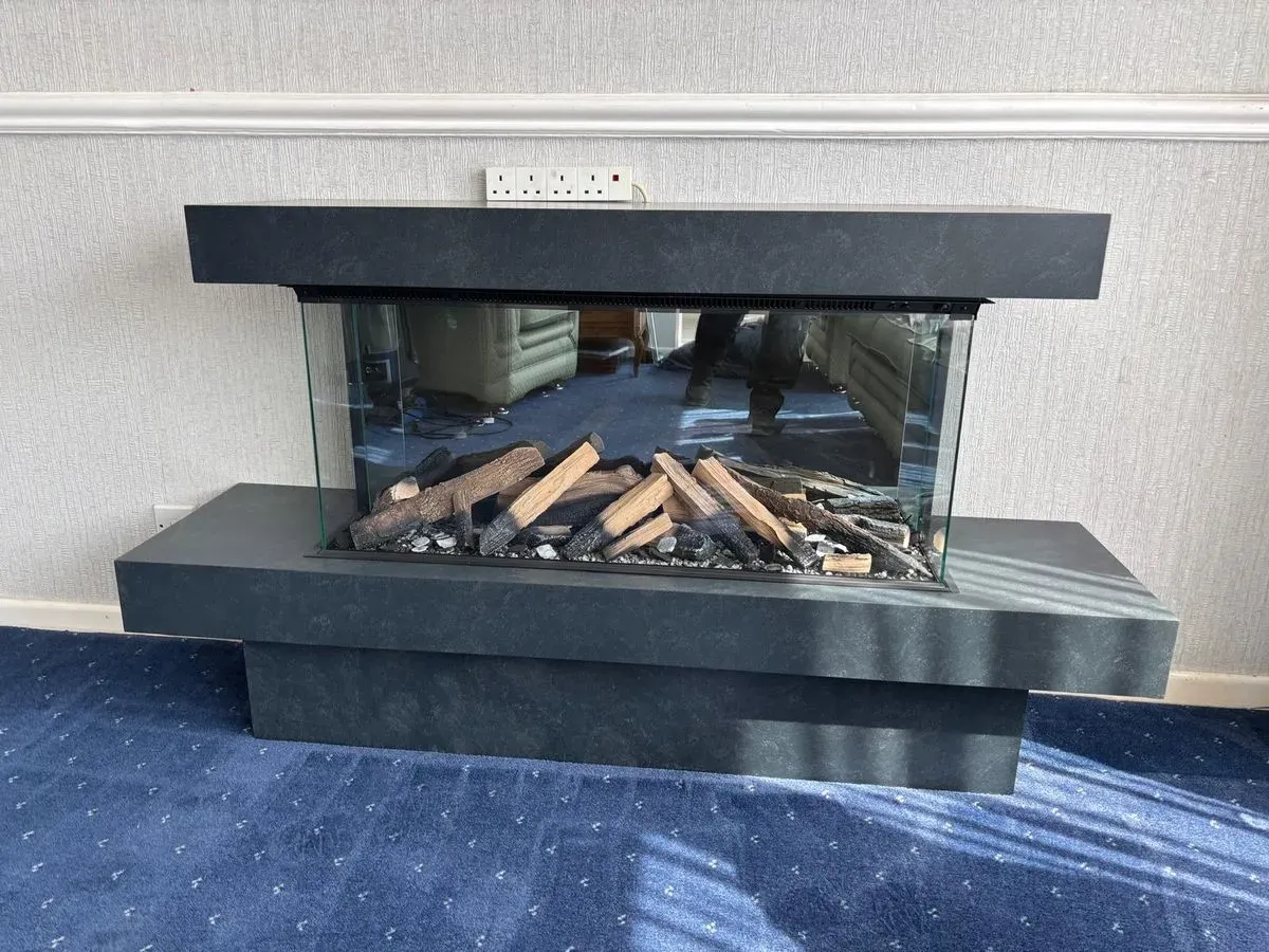 Solution Lux fire in a fireplace ready for the TV above, by Rugeley Fireplaces, Rugeley near Cannock