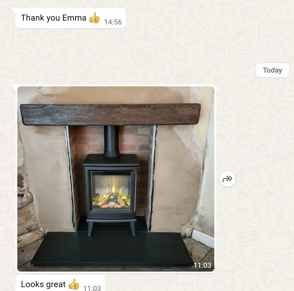 Solid oak beam  Brick chamber Honed granite hearth with electric stove and fake pipe in Staffordshire by Rugeley Fireplaces and Stoves Rugeley