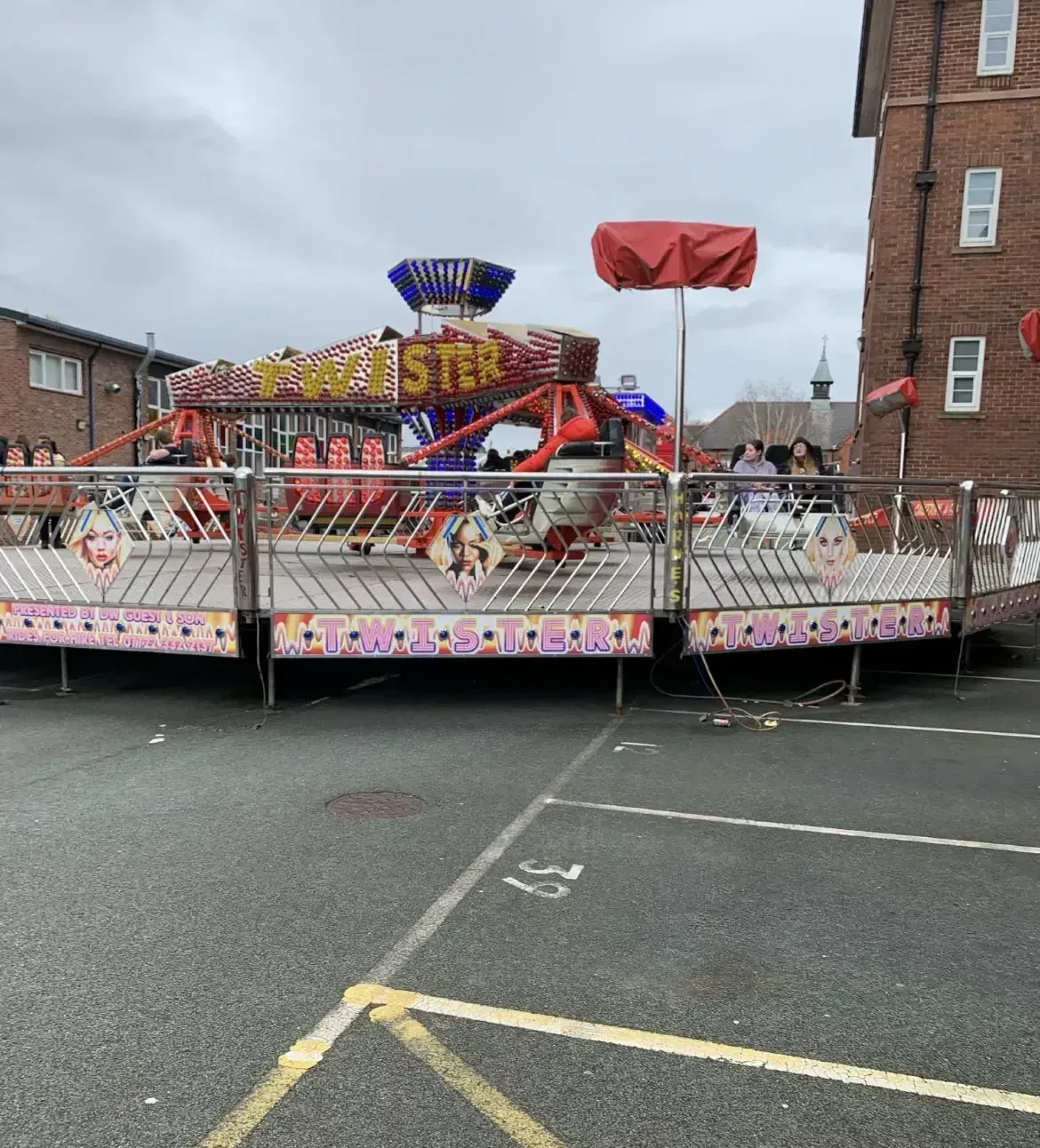 Community event featuring funfair rides in Leeds