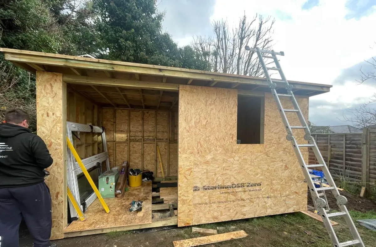 Local builders repairing a roof in Dunmow