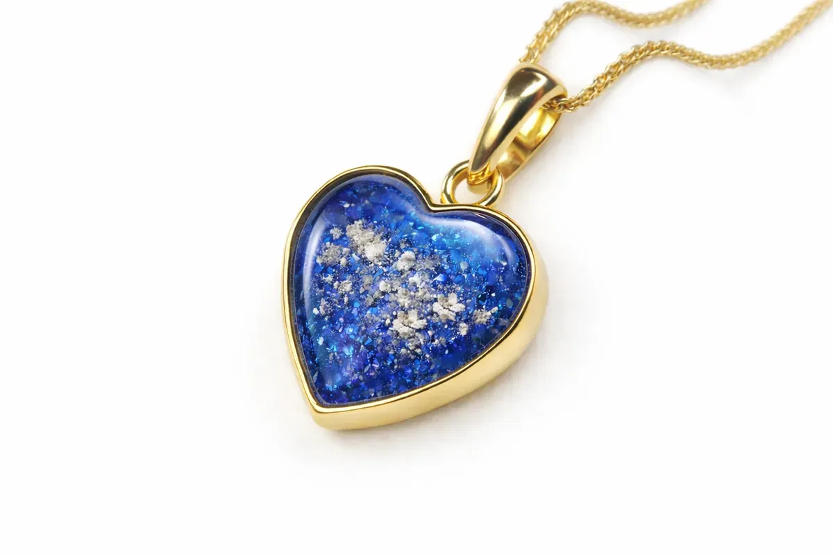 8224282120016-w38yn5n0ztqvy3d2z1m9pb-Gold-heart-pendant-with-blue-resin thumbnail image