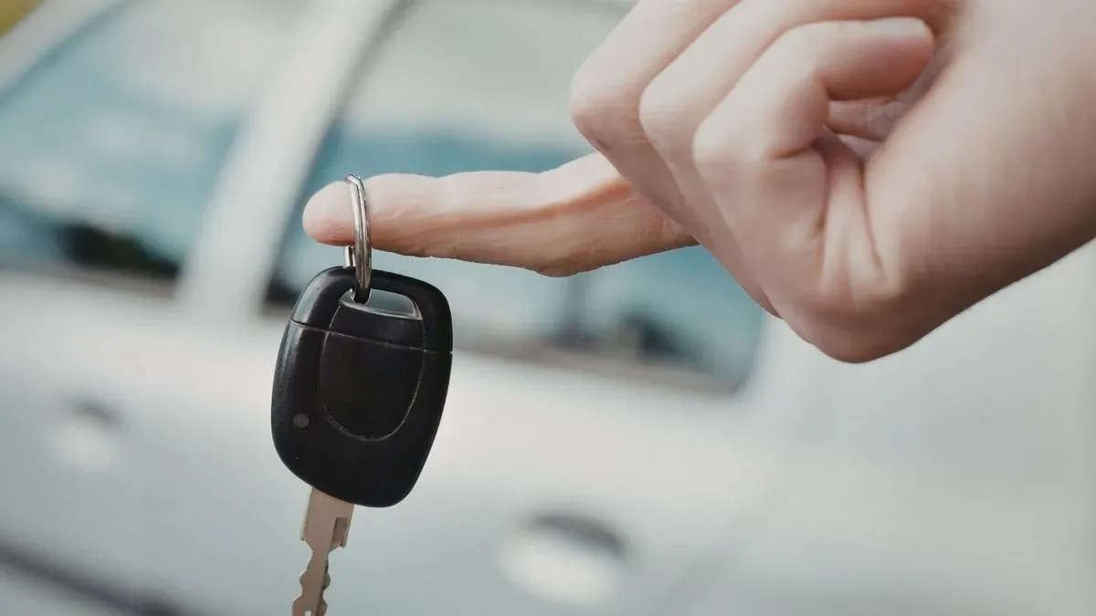 Locksmith working on a car near New Malden high street