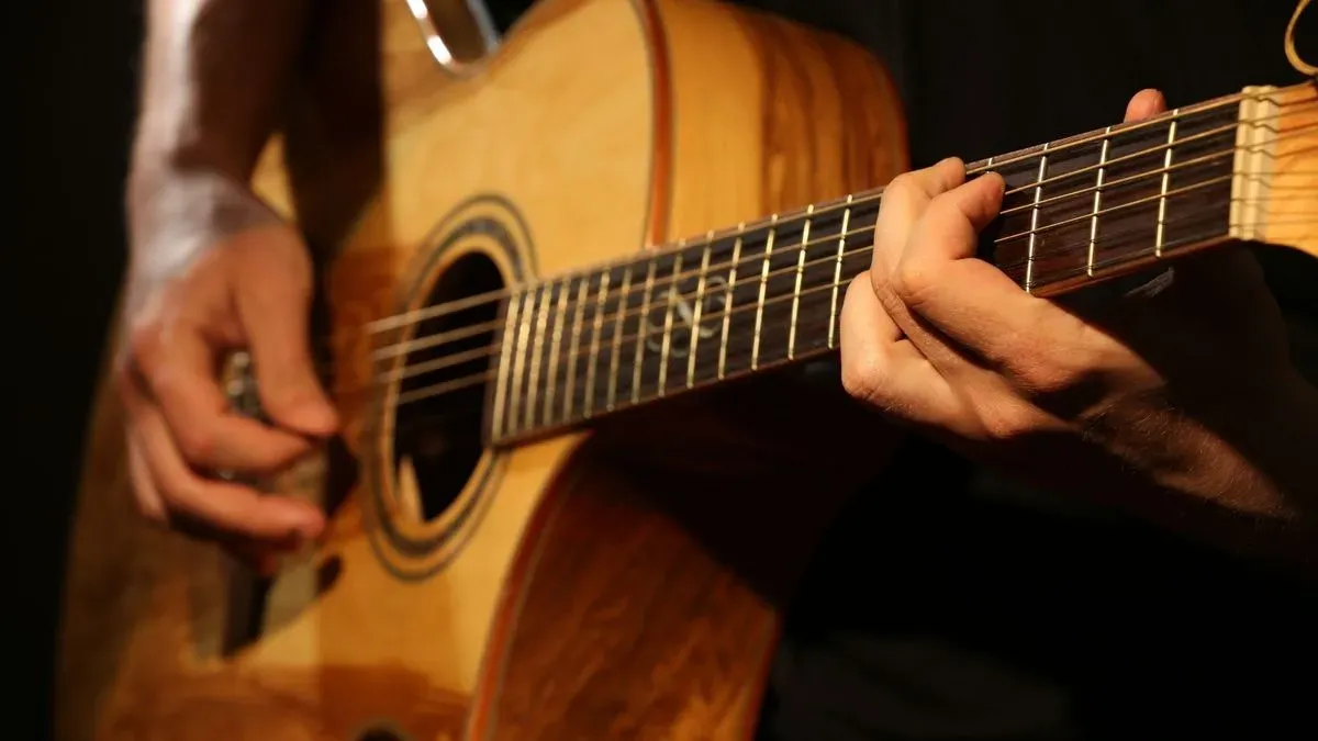 Group guitar lessons in a community setting in Chadwell St Mary