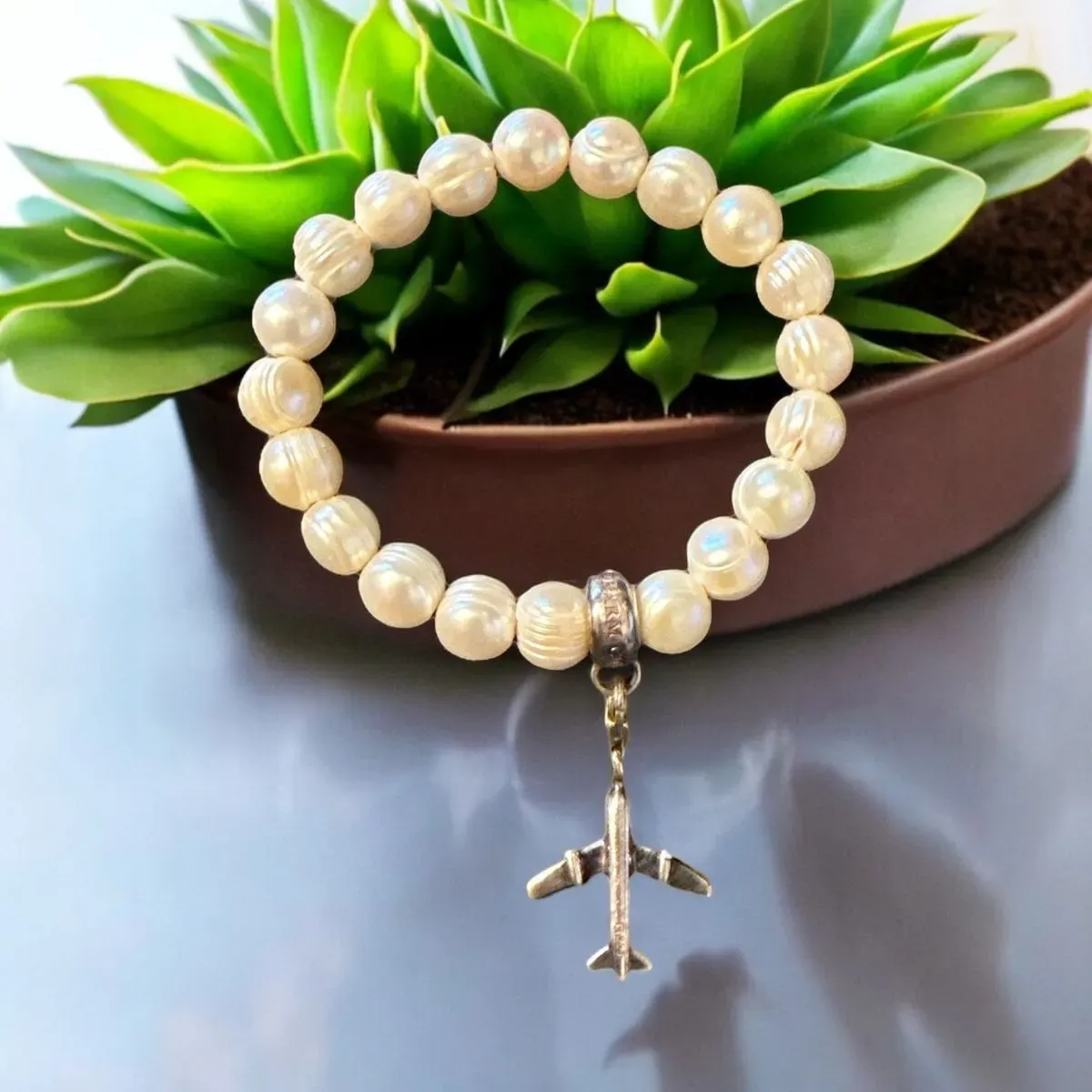 8219828933192-ycklguns15pxodp91ovmj-Fresh-pearl-Thomas-Sabo-bracelet-with-plane-charm thumbnail image